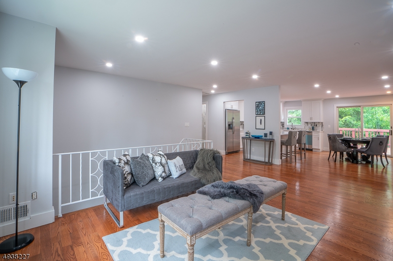 Stunning Bi-Level in the desirable Galloping Hill Section of town! This beauty is equipped with four bedrooms, hardwood floors, 2 full baths, & brand new kitchen with center island! Kitchen has sliding doors that lead to deck. Also on the top floor you will find the dining room/living room right off the kitchen creating that open floor plan every home owner desires. 3 generous size bedrooms and one full bath finish the top floor. On the 1st floor you will find a full bath, fourth bedroom, wine bar and family room. Near by schools, train station, bus stop to NYC and convenient stores. Home is vacant; go & show.