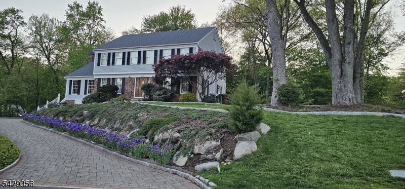 Home is very well maintained. Custom Built Colonial, boasting a large park-like property with a large deck overlooking the gardens and well-manicured property. Subject includes a gas fired fireplace in the large Custom Oak finished Great Room, Subject also includes a gas powered permanent whole house generator, Natural Gas barbecue, wine cellar, updated house alarm system, cedar closet with many more closets throughout the home, a 2 year old Sun setter awning above the large deck, a new central air conditioning system, central vacuum, water softener, heated garage, paver stone driveway, sprinkler system, a new 2 year old roof. Two attic fans, an outdoor garden shed and a garbage storage shed. The finished basement has direct outdoor access through the built-in garages with automatic door openers. Living room on first floor can be converted into a 5th bedroom.