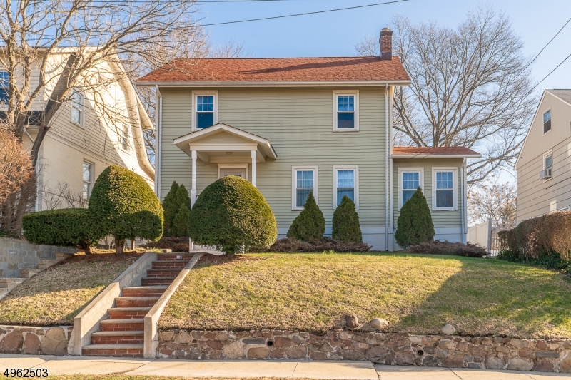 Welcome home to this CHARMING COLONIAL home, one block away from downtown center of Millburn. As soon as you walk in you are welcomed in a foyer area that leads to the living room, den and formal dining room. Through the kitchen there is a half bath, and an inviting 3 season porch. The upstairs has 4 bedrooms, full bath and the ability to walk to the attic through the hallway. Enjoy a fully finished basement that has a family area, sitting room that leads to an enormous backyard great for entertaining. There's also a full bath and laundry area. 4 Miles from the train that takes you directly to NYC, close to shopping, schools, parks and restaurants are an ADDED BONUS!.