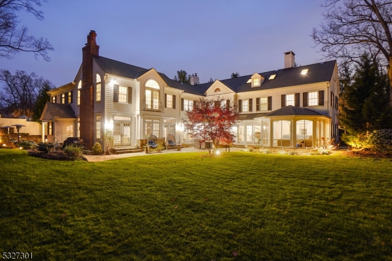 MAGNIFICENT CUSTOM-BUILT COLONIAL * Majestically perched atop 0.74 acres, this 8,060 sqft home has under-stated elegance, a thoughtfully designed floor plan, beautiful architectural details & is located on a preeminent street in the heart of Old Short Hills. It boasts light wood flrs, an open concept floor plan, 4 fire places,1st flr library/office, spectacular kitchen-family room & French doors that let in an abundance of natural light into every room. Entertain by the living rm fireplace, host in the elegant dining rm, toil in the library or unwind in the open kitchen-family room; this home has room for all. The state-of-the-art kitchen has custom cabinetry, top appliances (Dacor, Sub-Zero, Bosch), center island w/ quartz counters & bar seating, breakfast room, sitting rm, 2 pwdr rms, mudroom & 2-car garage. Head upstairs to find 6 BRs, 4FBs & new laundry. The luxurious Primary Suite has its own wing with two WICs, a private exercise rm & a newly renovated spa-like bath w/ two vanities, custom marble floor/tiling, soaking tub & over-sized glass shower. The 3rd flr is a full suite w/ bedroom, sitting rm & newly renovated full bath. LL: huge rec room, 2nd laundry & game room. Step outside: the Bluestone patio is an outstanding entertainment space, nestled amid lush lawns & perennial gardens (room for a pool!). Close to downtown Millburn, top-rated schools (Hartshorn Elem) & SH trains to NYC. This spectacular estate is both an architectural masterpiece & a private sanctuary.