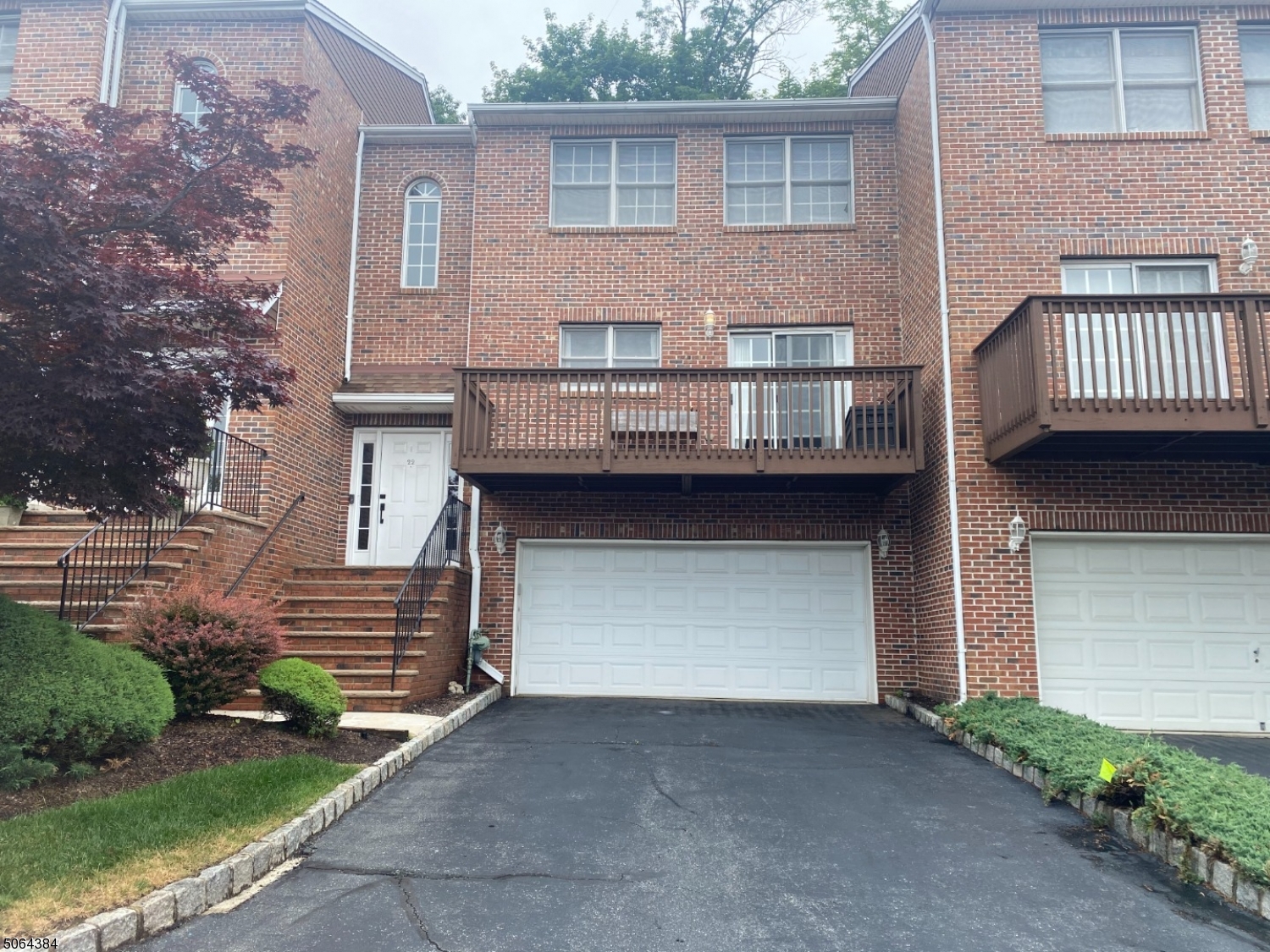 Bright spacious town home boasting an open floor plan with large eat in kitchen with Brazilian cherry floor, stainless steel appliances, walk-in pantry, and sliders to large deck to enjoy your morning coffee. Off the kitchen is the dining room overlooking a sunken living room w/wood burning fireplace and recessed lights. From here you can access the stone patio which with a gas grill and granite counter.  New powder rm.  On the second level the master br has new wood floors, organized walk in closet, Juliet balcony, and ensuite bath.  Equally large 2nd bedroom and third bedroom and bath complete this floor. Finished basement w family room laundry area & storage. Oversized 2 car garage.  Conveniently located to center of town, NY bus down the street and Rt 287