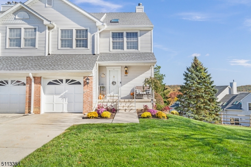 Spacious & unique end unit townhome in highly desirable Oak Hill at Independence!  Walk into the foyer to be greeted by freshly painted home with an abundance of natural light throughout. Kitchen is recently updated with new stainless steel appliances and floor. Hardwood floors throughout dining room and living room leading to deck with mountain view. New roof and skylights replaced in 2020! Enjoy new plush carpeting on the staircase and landing. Spacious master bedroom with large walk-in closet.  Substantially sized main bathroom with soaking tub & separate shower stall. Finished walk-out basement features family room with recessed lighting, utility room with 3 years young heat and AC, newly renovated laundry room with sink & newer washer/dryer, and built in home office. Walk out of sliding glass door to new deck. Extra storage in loft area of garage, too! Amenities include: Tennis and basketball courts, multiple playgrounds, and a large club house with spacious rooms available to be rented for special occasions! Minutes away from downtown Hackettstown & Route 80! Unpack and enjoy the relaxing lifestyle of Oak Hill!