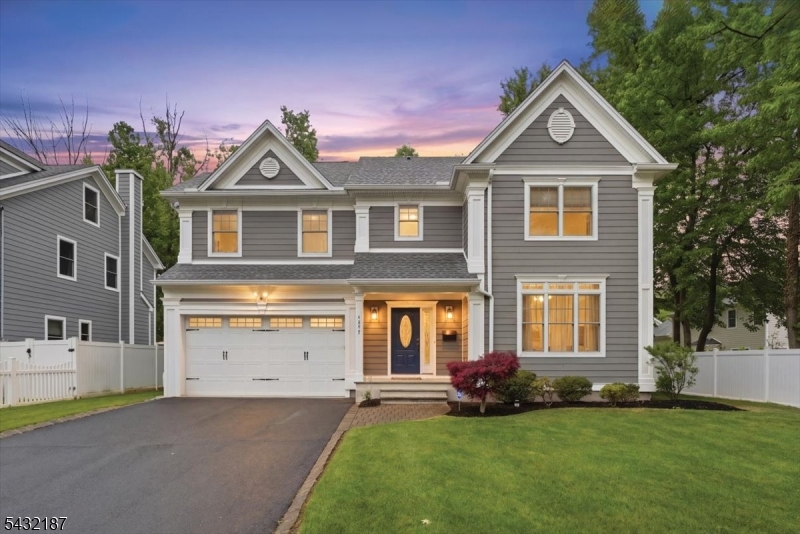 Expertly designed for both everyday comfort and effortless entertaining, this expansive Westfield Colonial offers over 4,000 square feet of finished living space across four beautifully finished levels. A light-filled interior welcomes you with high ceilings, hardwood floors, elegant millwork, and a seamless layout designed to balance functionality with timeless style. The eat-in kitchen features JennAir appliances, a center island, abundant cabinetry, and open flow to the main living spaces and family room with gas fireplace. Formal living and dining rooms provide inviting gathering spaces, while six spacious bedrooms and 5.1 baths offer exceptional versatility for guests, work-from-home living, or extended household needs. Upstairs, the luxurious primary suite offers a serene retreat with a spa-like bath, soaking tub, stall shower, and walk-in closet, alongside generously sized secondary bedrooms and convenient second-floor laundry. The finished basement with tall ceilings adds substantial recreation and lifestyle space, while the finished third floor provides additional bedrooms and bath space ideal for guests, offices, fitness, or creative use. Outside, landscaped grounds, underground sprinklers, and a low-maintenance exterior complete the home. With multi-zone heating and cooling, a two-car attached garage, and convenient access to major highways and transportation, this home offers an exceptional blend of scale, comfort, and modern living in Westfield.