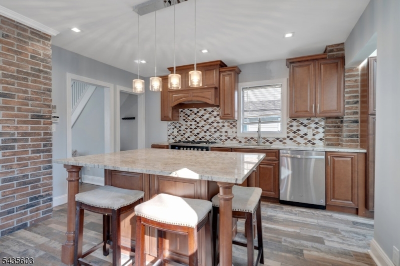 Welcome to 51 Cedar St, nestled in the beautiful town of Nutley, New Jersey. This charming home features 3 bedrooms and 1.5 bathrooms, offering a perfect blend of comfort and modern updates. The first floor welcomes you with a spacious living room and a beautifully renovated kitchen complete with a center island   perfect for cooking, hosting, and entertaining guests. From the kitchen, step out to a deck and a fantastic backyard, ideal for relaxing or outdoor gatherings. A convenient half bath completes this level. The finished basement provides a versatile space that can be used as a home gym, office, or recreation room. On the second floor, you'll find two large bedrooms and a full bathroom. The third floor offers a private additional bedroom. The property offers a generously sized driveway and a 1-car garage. Fully remodeled in 2017 with a new roof completed in 2024, this home has been lovingly maintained, and the sellers are not aware of any major issues.