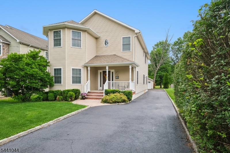 Don't miss this Center hall Colonial w/covered front porch, spacious rooms and a floor plan with the perfect flow for entertaining and everyday living. First floor has 9 foot ceilings throughout w/spacious foyer, elegant formal living & dining rooms and a secondary hallway w/guest lavatory, pantry closet and access to basement. The extra-large kitchen contains generous counter/cabinet space and overlooks the breakfast nook and family room w/an adjacent full size laundry room. Convenient side door to rear driveway, 2 car detached garage and yard.  The second floor boasts oversized bedrooms and baths including a primary bedroom, with walk in and double closets, en-suite bath w/stall shower, separate soaking tub, two vanities and an inside linen closet. Three additional bedrooms (two with walk in closets) complete this floor w/tub/shower hall bath, double vanity and hall linen closet. Recessed lights in most rooms along with wood & tile floors on the first floor, carpeting & tile floors on the second.  Additional potential continues with the unfinished lower level and its 15 foot ceilings just ready to be finished into multiple areas for additional living & entertaining space. Two separate HVAC's for added efficiency. Conveniently located to highways, Manhattan Direct train/bus, popular shopping/dining areas in Florham Park and Madison, town recreational facilities, public library, gazebo concerts and all the other amazing landmarks and attractions Florham Park has to offer!