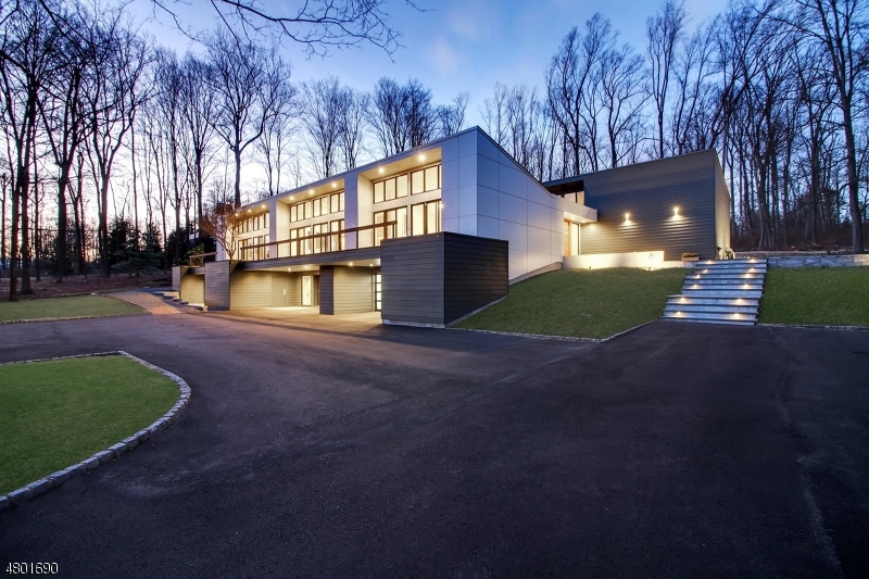 Leave the ordinary behind and aspire for nothing less than this breathtaking modern architectural masterpiece. Custom designed and recently renovated from top to bottom with only the finest materials, this exclusive 5 bedroom residence on three acres is truly one of a kind in the heart of New Vernon. As you wind up a long private drive, the home creates a commanding presence and does not disappoint. Boasting an open concept floor plan with soaring ceilings, new walls of windows and a center atrium with Japanese garden, it is a home perfectly designed for today's modern lifestyle. Another compelling reason for living in New Vernon? Real estate taxes for this home were $16,398 in 2017, less than half when compared with surrounding towns for a similarly sized home. Don't miss this rare opportunity!