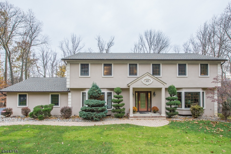 WELCOME HOME to one of the most desirable neighborhoods in Denville! This wonderful CH colonial boasts 4 spacious bedrooms, 3.1 updated baths, hardwood flrs, central A/C, natural gas, public sewer and water. New kitchen features custom cabinetry, leathered marble countertops, BLK S/S appliances, large center island. Family room has custom built-ins & a wood-burning fireplace for those cozy winter nights. Fabulous finished basement w/wet bar is ideal for entertaining. Backyard oasis is perfect for any staycation with an in-ground heated pool w/spa steps. New roof in 2018. Home Warranty incl.