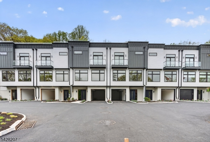 Discover modern living in these newly constructed luxury townhouses, designed with elegance and functionality in mind. Each home offers 3 spacious bedrooms and 2.5 bathrooms, providing the perfect balance of comfort and style. Enjoy the convenience of a 2-car tandem garage on the entry level, ensuring ample parking and storage space. The main living areas are thoughtfully designed with open layouts, creating an inviting flow for both everyday living and entertaining. Upstairs, the third floor hosts the bedrooms and a dedicated laundry area, adding ease to your daily routine. The primary suite features a spa-inspired bathroom, complementing the modern finishes throughout the home. The highlight awaits above: a private rooftop terrace on the fourth floor, ideal for entertaining guests or relaxing under the stars. With room for outdoor dining, lounging, and enjoying panoramic views, this rooftop retreat truly sets these townhomes apart. Experience the perfect blend of sophistication, comfort, and convenience your dream home awaits. It is also 12 miles from the Lincoln Tunnel and 16 Miles from the George Washington Bridge.