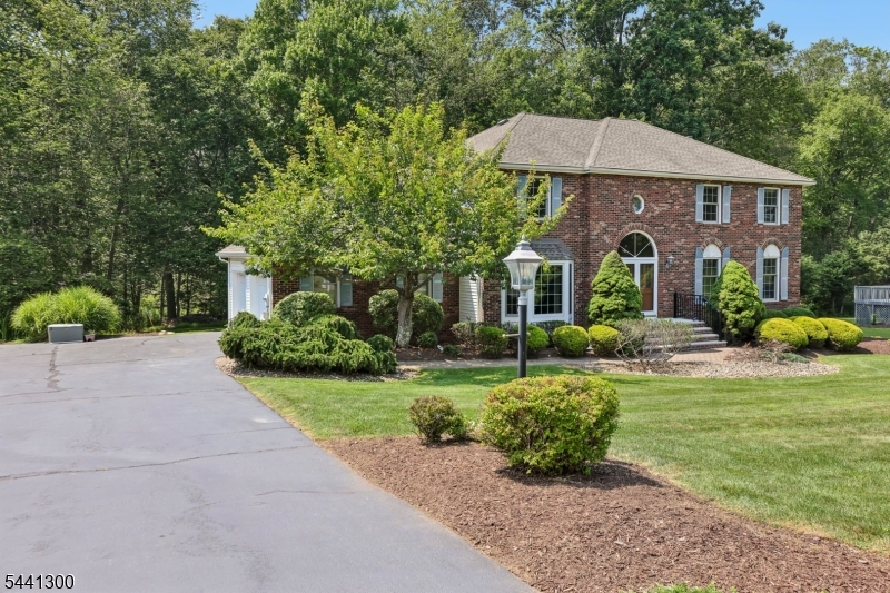 Welcome to this classic colonial, where generous living spaces, tasteful updates, and a peaceful cul-de-sac setting come together in one of Randolph's most sought-after neighborhoods. The impressive two-story entry sets the tone leading to a floor plan designed for comfortable everyday living. The spacious eat-in kitchen opens to the inviting family room with a wood-burning fireplace, creating the perfect gathering space. Formal living and dining rooms are ideal for hosting holidays and special occasions. A first-floor laundry room, powder room, and convenient interior access from the attached two-car garage add to the home's everyday functionality. Updated windows fill the home with natural light. Upstairs, you'll find four generously sized bedrooms, including a private primary retreat with a walk-in closet, large bonus sitting area/flex space, and beautifully updated ensuite bath. An updated hall bath with double sinks serves the additional bedrooms. The full unfinished basement offers outstanding potential to create the space that best fits your lifestyle while providing abundant storage. Step outside to an expansive deck overlooking a private, park-like backyard. Public water, sewer, and natural gas offer added convenience. Additional bonus features include young 13 year old roof, new hot water heater and 11 year old furnace.  Ideally located near Randolph's top-rated schools, parks, shopping, dining, Morristown, major highways, and NYC commuting options.