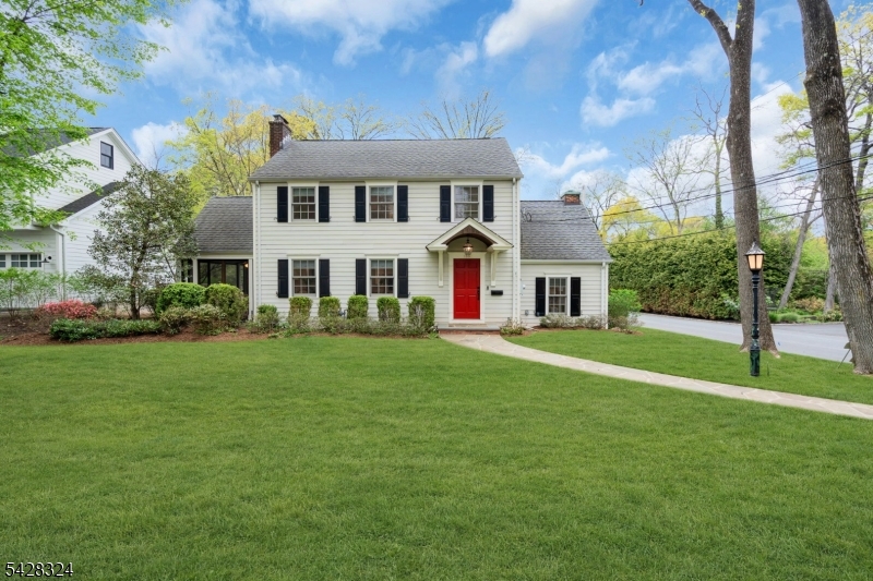 Sophisticated Living in Chatham Borough's Premier Upper Washington Avenue Section. Experience the pinnacle of suburban luxury in this exquisitely updated 4-bedroom, 3.5-bathroom residence, perfectly situated in the highly coveted Upper Washington Avenue neighborhood of Chatham Borough.The centerpiece of this home is a stunning 2023 kitchen remodel designed for the modern epicurean. It features custom white cabinetry, a sprawling center island, and a full suite of professional-grade Thermador appliances. This bright, open-concept heart of the home flows effortlessly into the main living areas, making it as functional as it's beautiful. This home is thoughtfully designed for today's lifestyle, featuring 2 dedicated home offices for those who work remotely and a fully finished basement. The lower level adds significant living space, including a cozy TV room ideal for movie nights or a play area. Designed for those who love to entertain, the property boasts exceptional indoor-outdoor living and dining spaces, perfect for al fresco dinners or quiet morning coffee. Upstairs, you'll find four spacious bedrooms, including a serene primary retreat, complemented by thoughtfully updated bathrooms throughout. The location offers an unparalleled lifestyle. You are just moments away from the Chatham Train Station, providing a seamless Midtown Direct commute to NYC. Enjoy easy access to Chatham's highly rated schools, charming boutique shopping, excellent local dining, and great community.
