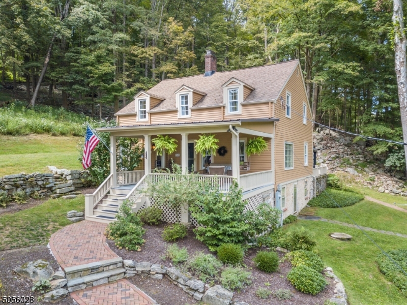 An absolute retreat from the hustle and bustle of the real world. Updated, historic 1774 colonial on private, serene 5 acres w/south branch of Raritan River running through base of property. Inviting covered front porch encourages relaxation while enjoying your own slice of heaven. Rear of home offers paver patio w/4 poster canopy; 1 car garage, and separate, private home office/studio outbuilding w/heat/air conditioning. Step inside and fall in love w/wide plank pumpkin pine floors, exposed stone walls, hand-hewn beams, updated granite kitchen, living rm w/FP w/wood stove insert. 3 BRs + loft area, renovated Bath complete 2nd fl. Unfinished walk-out basement. Newer boiler/hot water heater, septic new 2016; interior and exterior completely recently freshly painted. See full list of features in media section.