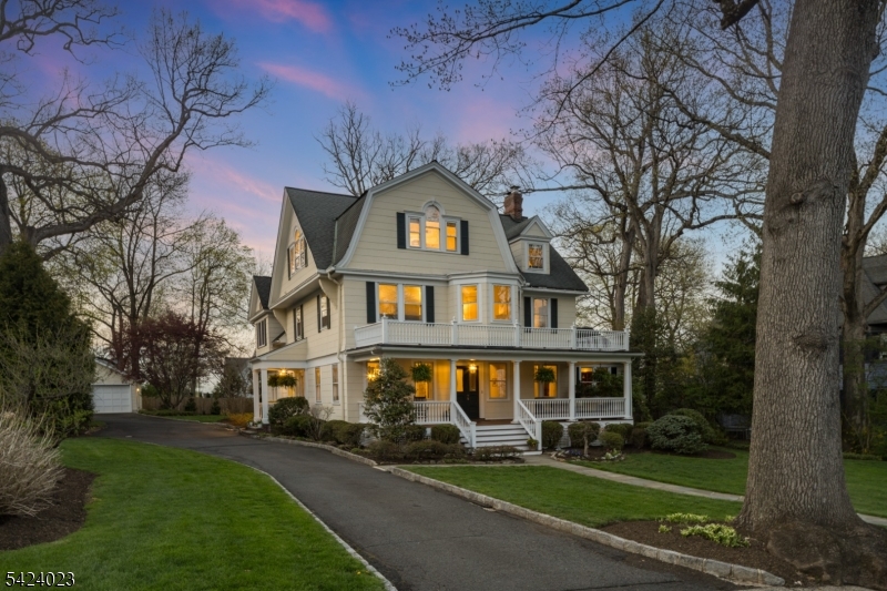 MAGNIFICENT GRAND COLONIAL IN SUMMIT'S PRESTIGIOUS OAK RIDGE NEIGHBORHOOD, CLOSE TO BRAYTON ELEMENTARY, MEMORIAL FIELD & DOWNTOWN! Experience timeless elegance in impeccably updated home blending classic character w/expansive, modern living. Step onto mahogany front porch. Inside, the stately Foyer has soaring cove ceilings curving into original picture molding, archways, period millwork & hardwood floors. Frml Dining Rm & Mudroom lead to expansive newly renovated Eat-in Kitchen w/custom cabinets, quartz counters/backsplash, high-end appliances (Viking & Sub-Zero), new wide-plank white oak floors w/ radiant heat &endless storage. 9ft center island w/ additional prep sink & 2nd oven! Breakfast Rm w/custom desk in front of French doors to back Patio & private, level Backyard. Kitchen opens to expansive Family Rm w/12.5ft vaulted ceilings, 4 skylights, bay window, fireplace set in wall of Premier built-ins & dry bar w/ fridge! Frml Living Rm offers 2nd fireplace &access to back deck. Stately library w/ mahogany paneling, windows on 3 sides, built-in bookcases &window seats. Sprawling Primary Suite encompasses left wing of 2nd Level & boasts Bathrm, Fitness Rm, Walk-in Closet & light-filled Bedroom w/extensive built-ins. 3 additional Bedrooms w/hardwood floors & newly renovated Hall Bath completes 2nd Level. 3rd Level has 3 large Bedrooms, skylights, closet space & Full Bath w/custom built-ins & soaring ceilings. Finished LL boasts Wine Cellar, Laundry, Rec Rm, Game Rm & Storage.