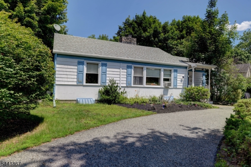 Welcome to the highly desirable Cupsaw Lake community in scenic Ringwood! This charming 3 bedroom, 1.5 bath ranch is full of character and awaiting it's next owner's vision. Inside, you'll find a warm and inviting layout featuring built in shelving, an original tiled fireplace mantel and timeless details that add to the home's unique appeal. With a little TLC, this home offers incredible potential. Situated on a spacious 0.61 acre lot, the property features a circular driveway accented by nature privacy bushes, along with a peaceful pathway leading to a secluded garden area surrounded by lush greenery. Enjoy all the Cupsaw Lake community has to offer, including a freshwater lake with swimming, boating, fishing, kayaking, as well as a vibrant clubhouse featuring the popular "Fabulous Friday" summer events. Conveniently located near hiking trails, parks, botanical gardens, and shopping, this is a wonderful opportunity to enjoy lake community living in the heart of Ringwood. Some photos have been virtually staged and digitally enhanced to illustrate the property's potential. Furnishings, decor, and enhancements shown in these images are for marketing purposes only and may not reflect the home's current condition.