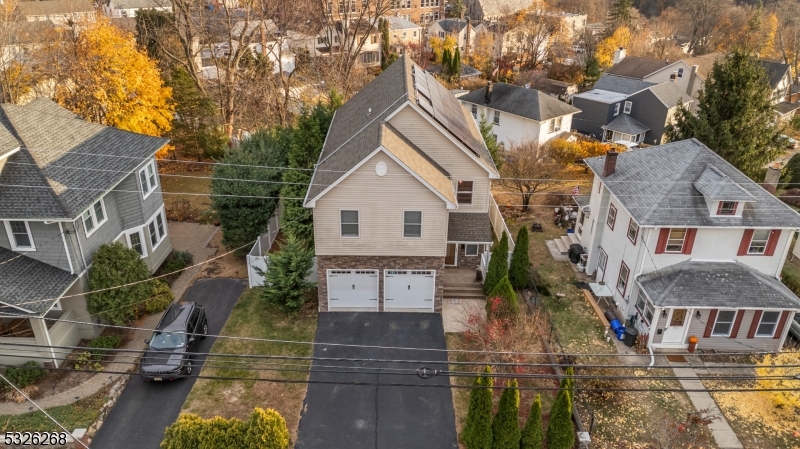 Experience this superbly crafted Stone-Faced Colonial in picturesque Boonton Town featuring an Entertainer's Dream backyard! Upon entry you are greeted by a soaring 2-Story Foyer accompanied by an Open-Concept Floor Plan with gorgeous hardwood floors showered with natural light all-throughout. The First Floor features a MASSIVE Family Room with slider door access to a private Deck, Eat-In Kitchen with Center Island / Breakfast Bar, beautiful Granite Countertops, custom Backsplash, Stainless Steel Appliances, and Dining Room space. Ascend to the Second Floor where you will find 4 spacious Bedrooms and 2 Full Baths including a Primary Bedroom offering 14FT Vaulted Ceilings, an En-Suite Bathroom with granite Dual-Vanity Sink, Jetted Tub & Stall Shower. The Full Finished Basement has High Ceilings with a BONUS High Efficiency natural-gas Dyna-Glow Wall Heater and is your canvas awaiting your design and creativity. The Backyard Oasis boasts a private composite Deck with incredible views and a spacious level backyard space allowing endless possibilities ideal for relaxation, hosting, and entertaining. Boonton Town is a walkable town with sidewalks, close to Main Street, nearby Top-Rated Dining, Grocery Stores, Boutiques, Shops, and much more! Do not miss the opportunity to own your Dream Home!