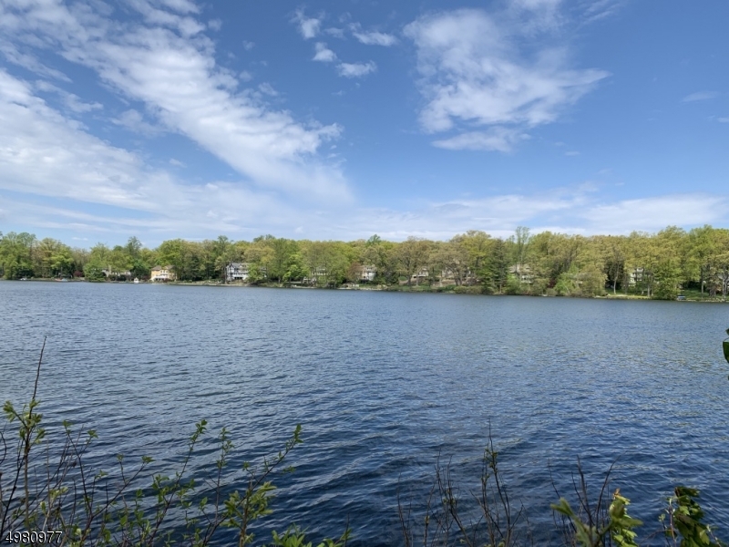 Vacant Land for comp purposes. Lakefront lot on the Main Lake of Mountain Lakes. 101' of lake frontage on the widest part of the lake.  Public Water/public sewer/electric at street. Design and build your own house. Fabulous lake community.