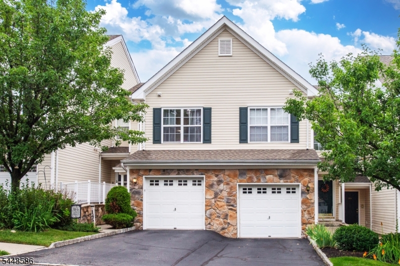 Welcome to The Highlands of Pompton Lakes! Perched in one of the community's most desirable locations, this beautifully maintained 3-story townhouse offers breathtaking panoramic views of Pompton Lakes and the surrounding mountains.This spacious home features 2 bedrooms, 3 bathrooms, an attached one-car garage, hardwood floors, a cozy gas fireplace, and updated kitchen and baths that blend style with everyday functionality. The sun-filled open-concept living and dining area is ideal for relaxing or entertaining, with expansive windows showcasing the spectacular views.The primary suite offers vaulted ceilings, a private en-suite bath with double sinks, three closets including a walk-in, and stunning mountain views. The second bedroom provides flexible space for guests, a home office, or additional living needs.The finished walk-out lower level adds valuable living space, perfect for a family room, media room, office, gym, or guest area, with direct access to the patio. Enjoy the private deck or patio while taking in the peaceful surroundings and beautiful sunsets.Residents enjoy beautifully maintained grounds, two in-ground pools, and a low-maintenance lifestyle, all within walking distance of shopping, dining, parks, public transportation, and with easy access to major highways. Combining updated finishes, exceptional views, and a prime location, this move-in-ready home offers comfort, style, and convenience. Don't miss this opportunity!