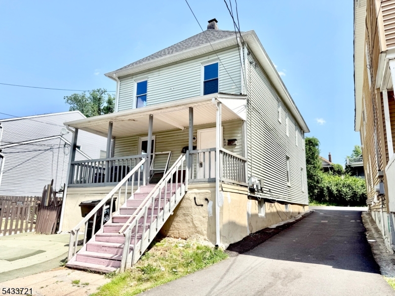 ready for new owner. parking lot in the back of house. two unit. finished basement;  newly cleaned and paint,  3 year old roof, newer stove, refrigerator, two new hot water heaters; few blocks to train station. ready for new tenant. easy to show. lowest price for neighborhood.