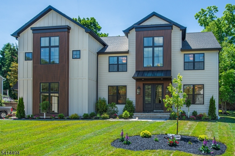 Experience luxury living in this stunning NEW construction home offering over 6,500 Sq Ft of beautifully designed living space across four finished levels w. RARE bonus finished exterior carriage space w. full bath. Featuring 7 bedrooms, 7.2 baths, and a thoughtfully designed floor plan.  A grand 2-story foyer welcomes you into sun-filled living spaces w/ white oak hardwood floors, designer lighting, custom millwork, and a dramatic 2-story family room w. a floor-to-ceiling windows & quartz fireplace. The gourmet kitchen is a true showpiece, featuring a 10' x 6' waterfall island, premium 42" fridge & 48" range, custom cabinetry, fluted tile backsplash, wine bar, & walk-in pantry. The luxurious primary suite is a spa-inspired retreat w/vaulted ceilings, expansive WIC, soaking tub & oversized shower. Highlights include a 1st floor bedroom suite, office, mudroom & 2nd floor laundry. A fully finished basement designed for entertaining, w/ high ceilings, spacious recreation room, custom dry bar, bedroom & full bath. Finished 3rd floor for additional living space w/ a bedroom and bonus room. Set on a professionally landscaped lot, the exterior showcases oversized Andersen windows, paver patio, insulated 2-car garage & more! Endless possibilities w/ finished carriage space, w/ private bathroom, accordion doors, a wet bar. Perfect for a gym, workshop, or secondary private office.  Ideally located near top-rated schools, major highways, NJ Transit, shopping, parks, and country clubs!