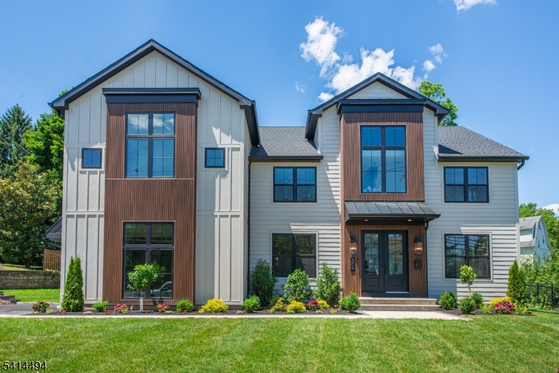 Experience luxury living in this stunning NEW construction home offering over 6,500 Sq Ft of beautifully designed living space across four finished levels w. RARE bonus finished exterior carriage space w. full bath. Featuring 7 bedrooms, 7.2 baths, and a thoughtfully designed floor plan.  A grand 2-story foyer welcomes you into sun-filled living spaces w/ white oak hardwood floors, designer lighting, custom millwork, and a dramatic 2-story family room w. a floor-to-ceiling windows & quartz fireplace. The gourmet kitchen is a true showpiece, featuring a 10' x 6' waterfall island, premium 42" fridge & 48" range, custom cabinetry, fluted tile backsplash, wine bar, & walk-in pantry. The luxurious primary suite is a spa-inspired retreat w/vaulted ceilings, expansive WIC, soaking tub & oversized shower. Highlights include a 1st floor bedroom suite, office, mudroom & 2nd floor laundry. A fully finished basement designed for entertaining, w/ high ceilings, spacious recreation room, custom dry bar, bedroom & full bath. Finished 3rd floor for additional living space w/ a bedroom and bonus room. Set on a professionally landscaped lot, the exterior showcases oversized Andersen windows, paver patio, insulated 2-car garage & more! Endless possibilities w/ finished carriage space, w/ private bathroom, accordion doors, a wet bar. Perfect for a gym, workshop, or secondary private office.  Ideally located near top-rated schools, major highways, NJ Transit, shopping, parks, and country clubs!