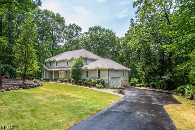 Meticulously maintained Colonial home w/4 bdms, 3.5 baths, 2 car garage & finished walkout bsmnt on a leveled 1 acre property in Round Hill Manor. Updated kitchen & baths, hardwd flrs throughout & professionally landscaped grounds. Inside, the large foyer branches off into a spacious, home office, ideal for today's work from home lifestyle & formal dining rm each w/beautiful French drs, perfect for large gatherings. Walking further along, brings you to an extended great rm(living/family rm) w/skylights, cath'l ceilings, track lighting, floor to ceiling brick fireplace & wet bar for endless entertaining. Anderson doors infuses plenty of natural light & easy access onto the expansive deck overlooking the private backyard sanctuary, protected by a fence for pets to run freely & vegetable patch for your gardening needs. Open eat-in kitchen w/stainless steel appliances, granite ctnr tops & stunning state of the art copper range hood-a chef's delight! Off to the kitchen, is a full bath, laundry rm, bedrm & entrance to garage, equipped w/Tesla/electric vehicle charging station & elevated platform for extra storage. 2nd fl has main bath, office & 3 add'l bedrms, which includes a master suite w/walk-in closet, lrg luxurious walk-in shower & double sink. Bsmnt w/Tuscan wine cellar, pwdr rm & enough space to offer a number of options for entertaining & relaxation. School bus stops at the front of the house. Highly rated school system, close to Pyramid Mt, restaurants, shops, major hwys