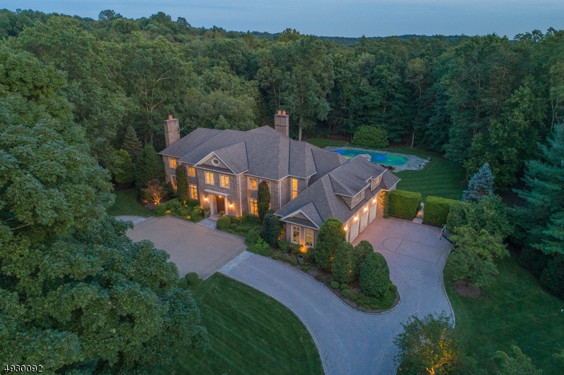 STUNNING AND BEAUTIFUL ESTATE, PRIME LOCATION ON ONE OF SADDLE RIVER'S MOST BEAUTIFUL STREETS. SWEEPING CIRCULAR DRIVE BRINGS YOU TO THE ENTRANCE OF THIS GRACIOUS HOME. SPECTACULAR 2-STORY MARBLE FOYER W/CURVED STAIR TO 2ND FLR BALCONY  THE BEST OF TODAY'S DESIGNER COLORS & MATERIALS ADORN EVERY RM. KIT W/ HW FLRS, QUARTZ COUNTERS,  HESTAN APPL, GUEST BEDRM/ BATH . 2ND FL: SUMPTUOUS MASTER W/ SEP SITTING RM, LUXURIOUS BATH, HIS & HER CLOSETS, PLUS 4 ADDITIONAL LOVELY EN-SUITE BEDRS. SECOND STAIRCASE, FULL BASEMENT & 4 CAR GARAGE. SPECTACULAR GROUNDS, PROFESSIONAL LANDSCAPING SURROUNDS OUTDOOR ENTERTAINMENT AREAS W/PATIOS, HEATED POOL & SPA, OUTDOOR KITCHEN & FPL, ONE OF SADDLE RIVER'S BEST PROPERTIES!