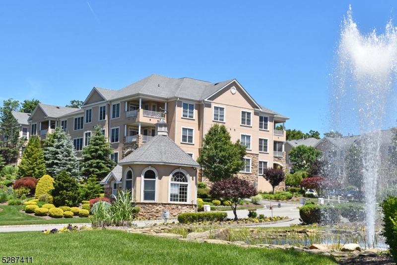 This Desirable 2 Bedroom, 2 Full Bathroom Unit Is Nestled Within A Secure And Gated 55+ Community. Wonderful first floor Buckingham Model in the Washington Building, immaculate, freshly painted, large sized bedrooms and bathrooms, ceiling fans in bedrooms and living room, walk-in closets, plenty of storage, central air, Top of the line New "Safe Step" "Walk-in Hybrid Tub, brand new Washer/Dryer, laminate flooring, plenty of natural lighting throughout, close to everything, such as restaurants, Rockaway Townsquare Mall, Shop Rite, Route 80, Route 15 and only 45 minutes to New York City by car, close to trains & buses in Dover, amazing Club house, quiet, residential area and so much more!  House is being sold "As Is."  Fox Hills has a wonderful clubhouse, fitness center, ballroom, library, arts and crafts studio, billiard, card rooms, indoor and outdoor swimming pools, sauna, tennis and bocce courts, and a Horticulture Center where residents can grow flowers and vegetables year-round. Residents enjoy a variety of social activities. Close to garage parking.