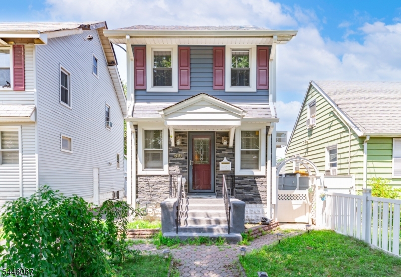 Charming colonial on a quiet Roselle street offering 2 bedrooms, 1.5 baths, and three finished levels of flexible living space. The sun-filled main level showcases gleaming hardwood floors, crown molding, and an elegant leaded-glass front door, flowing from the living room into a formal dining room framed by classic oak millwork. The eat-in kitchen features abundant oak cabinetry, granite-look counters, and a brick tile backsplash. Upstairs, two comfortable bedrooms share a full bath with decorative tile, while the finished third-level loft makes an ideal home office, den, or playroom. The finished basement expands your options further with a cozy sitting area, updated half bath, dedicated laundry room, and generous storage. Outside, enjoy a covered front entry, landscaped walkway with paver path, fenced yard with patio, and a detached garage. Minutes to schools, parks, shopping, NYC transportation, and the Garden State Parkway.