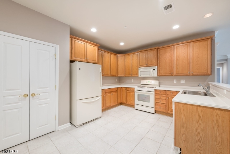 You'll LOVE cooking & entertaining in your FULL EAT-IN KITCHEN w/ a DOUBLE PANTRY & room for a TABLE FOR 4!  How about a separate DEN/OFFICE in addition to the guest bedroom? And lots of storage!! Great CLOSETS! CABINETS in the laundry rm & a SEPARATE 5' X 8' STORAGE CLOSET in the hall ON THE SAME FLOOR!!  Park benches & gazebos offer SOCIALLY DISTANCED visiting w/friends & family!  Or walk around the pond to see the egret, goldfish....  Somerset Run is an Active Over 55 community with a 25,000 s.f. Clubhouse boasting indoor & outdoor pools, gym, billiard, card & ballroom;  Tennis, pickle ball, bocci!!  Walk to shopping! Minutes to Big Box stores, Bridgewater Commons & NJ transit to NYC!  Enjoy Colonial Park, Del.-Raritan Canal Park, golf, fishing, theater and concerts!  JOIN US!
