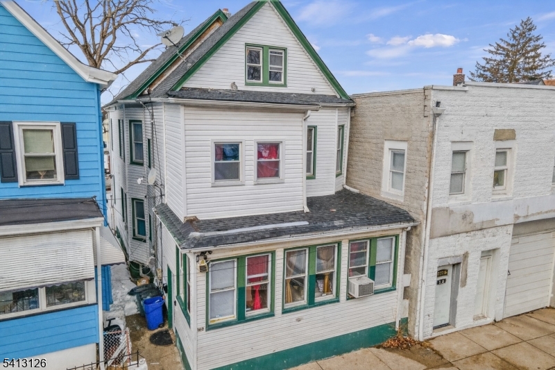 Welcome to this well-maintained two-home property in Passaic, offering space, versatility, and an unbeatable location. Featuring a total of 6 bedrooms and 2 full bathrooms, this property is ideal for Owner-occupants or savvy investors.The first-floor unit offers three generously sized bedrooms, a comfortable living room, a dedicated dining area, and a functional kitchen?perfect for everyday living and entertaining. The second-floor unit features three bedrooms, a bright living room, and a kitchen, providing excellent rental potential.A partially finished basement adds valuable bonus space for storage, recreation, or future possibilities. Conveniently located near schools, parks, shopping, and public transportation, this home delivers both accessibility and long-term value.A fantastic opportunity to own a multi-unit property in a high-demand area?don?t miss it!