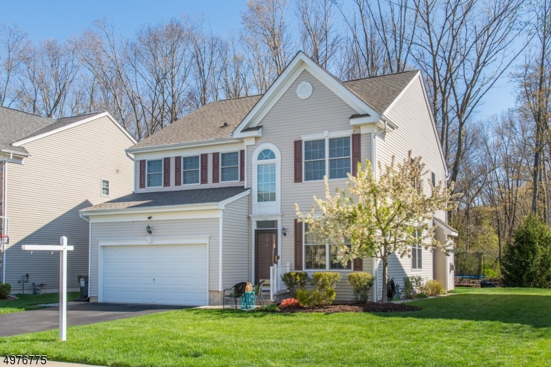 Beautifully appointed and lovingly maintained Hunter's Brook colonial.  Cul de sac location, level lot backs to woods w/ exterior professionally landscaped.  Open concept floor plan, too many upgrades to mention.  Oak flooring, gas fp, recessed lighting, custom blinds, crown moldings, multi-zone heat & AC, lawn irrigation system, cathedral ceilings & more. Top of the line upgraded kitch w/commercial grade appl. including cooktop + double wall ovens, center island & pantry.  Master BR has cathedral ceiling, sitting area, 2 walk-in closets, master bath wall to wall carpeting, dbl vanity, stall shower & soaking tub.  3 additional bedrooms, full bath & laundry room complete the second floor.  Basement has recently been refinished w/new laminate flooring.  See to believe!