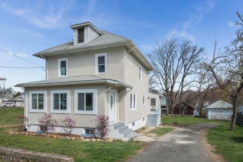 Welcome to this beautiful, remodeled colonial in the heart of Rockaway.  Hardwood floors run throughout the entire home. Period cut custom trim, highlights the craftsmanship of colonial homes from a time gone by. First floor offers  kitchen with granite countertops, SS appliances and access to a deck for entertaining. Living room, dining room, family room, full bath, and sun-porch. Second floor has 3 bedrooms, full bath and access to a walk-up attic with plenty of storage. Huge basement offers plenty of storage, laundry room, and outdoor access. Large level lot on great quiet street. Large garage.