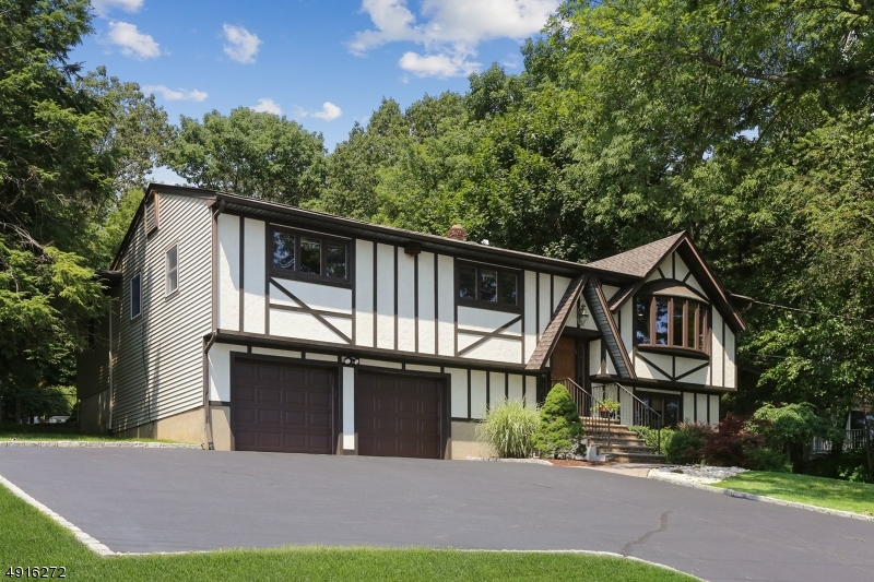 Fantastic home on half an acre lot with best views in Boonton. Do you want to feel like you are on vacation everyday of the year? Than look no further. This 4 bedroom, 3 car garage home has it all. Lower level is equipped with walk out family room, wood burning fire place, bedroom (currently used as an office) laundry room, and 3 car over sized garage. Main level boasts 3 more bedrooms, main bath, living room with soaring views, dining room and kitchen. Huge master suite has 25x15 with full bath, large closets and access to the deck. If you like to entertain look no further. Heated Gunite pool with spa and large deck offer ample opportunities for outdoor fun. Hardwood floors run throughout under carpeting. Natural gas in the street easy hook up. Truly a must see. Please see video tour in media section.