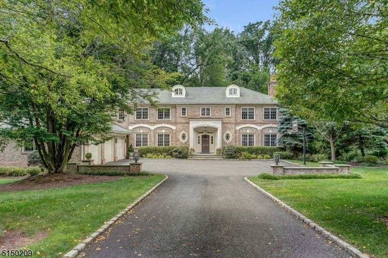 Spectacular custom built all-brick Center Hall Colonial designed by David Rosen, AIA & built by Vanco construction to the highest specifications w/ an ideal floor plan, rooms of generous proportion & terrific amenities including a state of the art home theater & stunning pool surrounded by lush landscaping on private, totally level property. Ideally located on a quiet street in Old Short Hills, walking distance to highly rated Glenwood Elementary (0.2 miles), Arboretum (0.3 miles), & Short Hills Train Station (0.5 miles). This immaculate home features a huge new gourmet eat-in kitchen w/ quartz countertops & backsplash, high end Dacor cooktop, SubZero refrigerator & freezer, & 2 dishwashers, totally open to the great room w/ 15'6" cathedral ceiling w/ exposed beam & 8 windows, 5 w/ transoms above. Sunlit breakfast room w/ 5 windows & French door that leads to an enormous deck, patio & pool flows to a huge dining room w/ beamed ceiling, built-in speakers & French doors overlooking the pool & gorgeous property. Massive dining room, totally open to the living room, is perfect for entertaining & can easily accommodate 50+ for dinner! 1st level features a bright office w/ built-ins, laundry room, & mudroom w/ access to attached 3-car garage. 2nd level has a luxurious Primary suite w/ a huge WIC & new spa-like bath, +4 more bedrooms, 3 more new baths & 2nd laundry room. Lower Level features a huge rec room, exercise room, state of the art home theater, 2 bedrooms & 2 full baths.