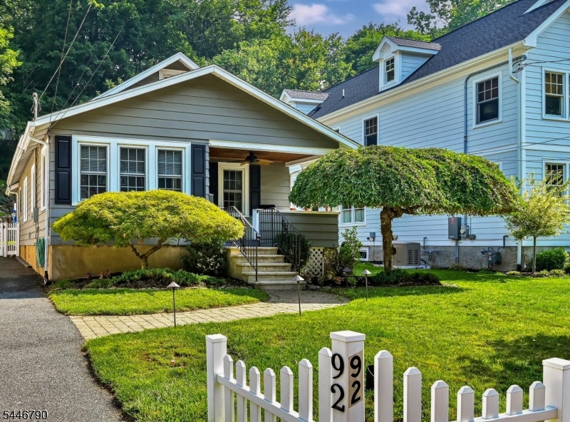 Surprisingly spacious and full of charm, this thoughtfully expanded Crafton-style cottage home is within walking distance of downtown Butler. Step through the brand-new front door with convenient keyless entry and discover a home that blends timeless character with modern updates. A light-filled parlor welcomes you, opening through an arched doorway into the living room, which flows seamlessly into the dining room and updated kitchen. The kitchen features granite countertops, newer cabinetry with abundant storage, an easy-access pantry, and a French door leading to the patio and a level, landscaped, fenced backyard.  A storage shed provides additional outdoor storage. The first floor also offers two bedrooms, an updated full bath, and a tucked-away staircase leading to a spacious finished loft. The finished, clean, and dry basement provides exceptional flex space. Also on this level are a generously sized laundry room with a convenient half bath, a ventless gas fireplace for added warmth during the colder months, and a dry bar with abundant storage. Additional updates include a newer HVAC system and a gas water heater. Conveniently located near Routes 23 and 287, shopping, restaurants, parks, schools, and NJ Transit, this home combines classic character with everyday convenience. A must see!