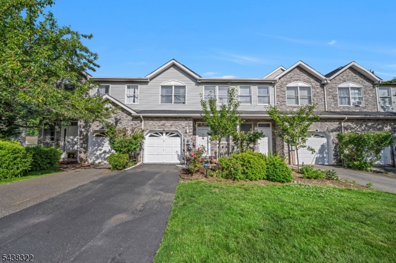 Welcome to this BEAUTIFULLY UPGRADED, MOVE-IN-READY TOWNHOUSE located on a quiet DEAD-END STREET in the highly sought-after GLENMONT COMMONS COMMUNITY. Featuring a desirable NORTHWEST-FACING ORIENTATION, this home offers 3 SPACIOUS BEDROOMS, 2.5 BATHROOMS, a 1-CAR GARAGE, and a BASEMENT providing ample storage and future finishing potential. Enjoy a LOW-MAINTENANCE LIFESTYLE in this well-maintained 265-UNIT PLANNED UNIT DEVELOPMENT, where the HOA covers access to the OUTDOOR COMMUNITY POOL, professional landscaping, irrigation, and common area maintenance.With abundant GUEST PARKING NEARBY and minimal through traffic, this peaceful enclave offers both COMFORT AND CONVENIENCE. Step inside to a BRIGHT AND INVITING MAIN LEVEL featuring GLEAMING HARDWOOD FLOORS throughout the living room, dining room, and kitchen. The spacious living room showcases a COZY WOOD-BURNING FIREPLACE, recessed lighting, CUSTOM BUILT-INS WITH QUARTZ COUNTERTOPS, and sliding glass doors that open to a PRIVATE DECK OVERLOOKING A LUSH, TREE-LINED BACKDROP perfect for relaxing or entertaining outdoors.The FULLY RENOVATED CUSTOM KITCHEN (2020) is the centerpiece of the home, offering HIGH-END GRANITE COUNTERTOPS, an extended custom layout, and premium SOFT-CLOSE CABINETRY. A beautifully remodeled powder room completes the main level.Recent upgrades include a NEW ROOF (2022), NEW HVAC AND BOILER (2024), a 3-year-old MICROWAVE, DISHWASHER, WASHER, AND DRYER, plus fresh professional paint throughout (2025).