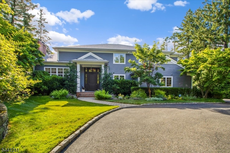 Spectacular Center Hall Colonial ideally located on 0.56 acres of totally level, beautifully landscaped property with mature trees for privacy and expansive patio with outdoor kitchen and fire pit for fabulous outdoor entertaining on a quiet cul de sac in the highly rated Hartshorn Elementary School District. This stunning home features a grand 2-story entrance hall, tremendous natural light from tons of windows, and every modern amenity including a built-in water filtration system, central vacuum, security system, stereo system, and whole house generator. The heart of the home is the gorgeous gourmet eat-in kitchen with a beautiful center island, top of the line appliances, & sunlit eating area w/ French doors to the expansive patio & backyard, totally open to the family room w/ gas fireplace flanked by built-ins, the ideal floor plan. The living room room features a gas fireplace and great natural light. A stunning dining room, impressive home office & powder room complete the 1st level. There is easy 1st level access to the attached 3-car garage. The 2nd level features a luxurious primary bedroom w/ 2 walk-in closets & lavish spa-like bath, & 4 more bedrooms that share 2 new baths. Beautifully finished lower level features a rec room w/ wet bar, a 2nd home office, full bath, & laundry room. Ideally situated on a rare cul de sac location, this stunning home is just .6 miles from Gero Park, the town's rec center, & close to top schools, the train station & downtown Millburn!
