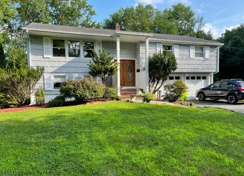 Opportunity knocks with this spacious 4-bedroom, 3-bathroom bi-level home, tucked away in a quiet cul-de-sac and offering the perfect canvas for investors or buyers looking to build immediate sweat equity through a full renovation. Being sold strictly as-is, the classic layout features a bright upper-level living area, a primary bedroom with an en-suite bath, and a fully finished lower level boasting a large family room, a fourth bedroom, and a third full bath. Complete with an attached 2-car garage and a generous backyard, the property's true crown jewel is its unbeatable location: you get the peace and safety of a no-outlet street while remaining within easy walking distance to both the local elementary and high schools, as well as a direct NYC bus stop for an effortless commute.