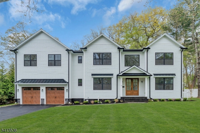 This stunning new construction in Florham Park offers 6,800 sq ft of luxury living with 7 bedrooms and 7.1 bathrooms. Ten-foot ceilings on the first floor and oversized windows create a bright, open atmosphere, while nine-foot ceilings on the second floor and walk-out basement maintain an expansive feel. The first floor includes a private in-law suite with kitchenette, en-suite bath, and generous closet space. Expansive living and dining areas are ideal for entertaining, anchored by a chef's kitchen with Viking appliances, oversized quartz island, and high-end finishes. All bedrooms feature en-suite baths, and an oversized second-floor laundry adds convenience. Outdoor living includes a composite deck, walk-out basement, and newly sodded yard with underground irrigation. Pre-wired for a whole-home mesh network, this home supports modern work-from-home lifestyles. Minutes from top schools, Midtown Direct trains, shopping, and dining, this rare new construction blends luxury, sophistication, and lifestyle.