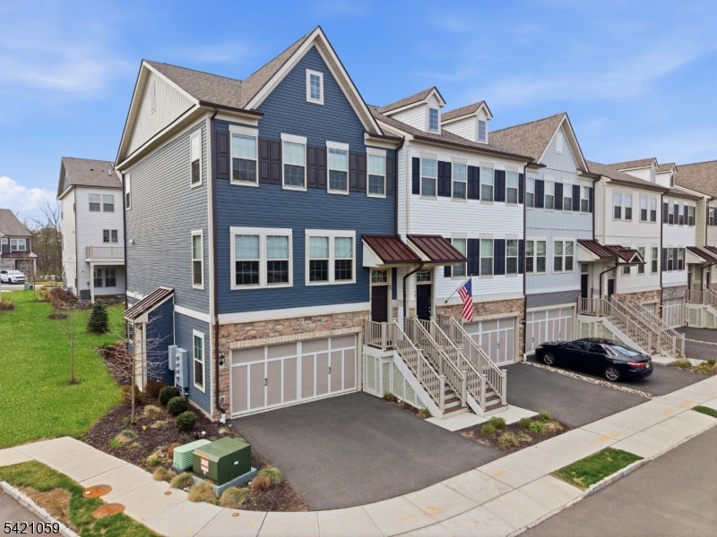 Experience elevated living in this impeccably designed East-facing Isleton model end-unit townhome, nestled within the prestigious Fairview at Warren community. This fully upgraded residence only three years old offers 2-car garage, driveway, 4 generously proportioned bedrooms, 3 full bathrooms, an elegantly appointed powder room and recessed lights thought the home. Thoughtfully enhanced with a rear extension, the home exudes an airy, open ambiance with abundant natural light throughout. The centerpiece is a chef-inspired gourmet kitchen, beautifully outfitted with high-end finishes and premium upgrades, flowing effortlessly into a sunlit morning room and out to a covered deck creating a seamless indoor-outdoor lifestyle ideal for both everyday living and refined entertaining. Indulge in private outdoor escapes with two serene decks one adjoining the sunroom and another extending from the luxurious owner's suite, offering a tranquil setting for morning coffee or evening relaxation. The walk-out lower level presents a versatile retreat, perfectly suited for a private guest quarters, executive home office, or upscale recreation lounge. Situated in the highly desirable Warren Township, this exceptional home is served by top-tier schools and is just moments from upscale dining, charming boutiques, and major commuter routes, including Route 78, providing effortless access to New York City. A must see!