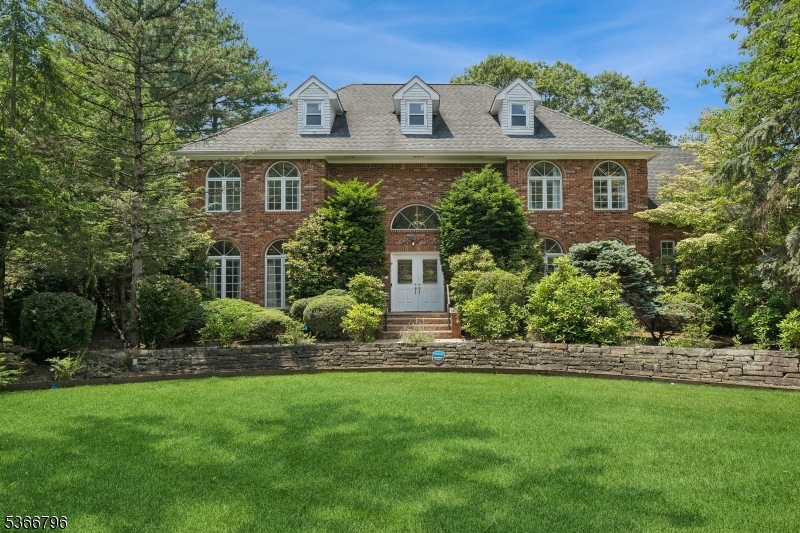 EXCEPTIONAL, STUNNING, AND LOVED STATELY COLONIAL in an enclave of luxury homes is waiting for you!!! Step in this light and bright home w/ amazing flow featuring five bedrooms and five & a half baths.  You will be impressed by a newer, huge, chef kitchen w/ white cabinets, oversized center island, quartz counter tops, and a wine bar.  You will love two story foyer opening to living room, formal dining room, family room w/ a wood burning fire place, powder room.  There is a great room w/ high ceilings and built ins, bedroom, full bath, and a laundry room there - in case you need in-law suite on the main level. Second floor offers: primary suite w/ a fire place, luxurious bath featuring a large shower and jetted tub, huge walking closet w/ custom built ins, additional built ins; princess bedroom w/ its own bathroom, two other spacious bedrooms, and a full bath.  Large finished basement w/ a kitchenette featuring sink, equipped gym (Skytrack simulator is excluded), full bath, a three-car garage. Large windows, mostly hardwood floors, two fireplaces, whole house generator, circular driveway, large deck w/ a new grill w/ 6 burners, Ceramic side Char Burner, Rotisserie, private patio, & a yard perfect for entertaining complete the picture of a wonderful property, WIFI app will let you voice-control lights, HVAC, cameras, & garage openers from anywhere in the world.  This home has been meticulously cared for!!  Too many things to mention - come & fall in love with your new home!