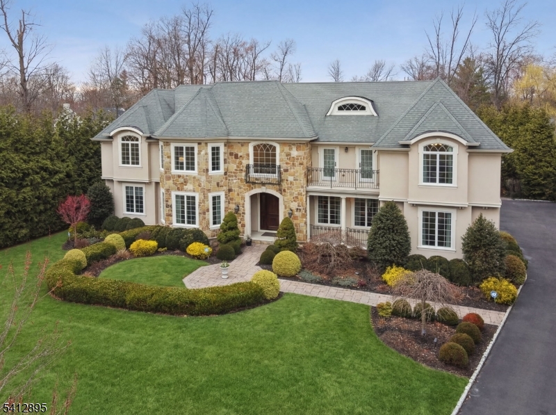 This is your Dream Home! 8,383 sq ft Center Hall Colonial Custom built for owners in 2013 is ideally located on totally level .67 acre lot on quiet street in highly rated Hartshorn Elementary School District. 7 bedrooms, 7 bathrooms (6 full baths and one powder room). Custom mahogany front door opens into a grand 2-story entrance hall with majestic staircase. Elegant dining room w/ custom moldings. Butler's pantry, stunning eat-in chef's kitchen w/ SubZero, Viking, & Bosch appliances, electric oven, granite countertop & oversized center island totally open to incredible family room w/ gas fireplace. Easy access from both the kitchen & family room to expansive patio & spectacular, level private backyard. Living Room w/ gas fireplace. Gracious 1st floor in-law suite w/ en-suite bath. Easy 1st floor access to oversized 3 car garage. Luxurious primary suite w/ 12' ceilings, gas fireplace, 2 huge custom walk-in closets & sitting room, & spa-like primary bath, jetted tub & steam shower. 3 more en suite bedrooms + another home office/bedroom & laundry on 2nd level. Beautifully finished lower level w/ walkout access, 9' ceilings, recreation room w/ large wet bar, movie theater w/ 96" screen, exercise room, large bedroom ste. Smart house features! Generac generator, large, level private backyard w/ expansive stone patio & basement access. Plenty of room for 20'x40' pool. Just 0.3 miles to Pingry School, 0.4 miles to Gero Park, & 0.8 miles to highly rated Hartshorn Elementary School!