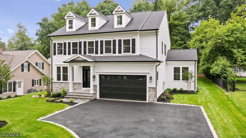 New construction - completed to perfection! Welcome to 5 Townsend, a stunning, 5-bedroom, 5.5-bathroom home located in Florham Park, NJ. Situated in a sought-after section of town - proximate to Route 24, Morristown Airport, and charming downtown Madison - this residence offers four floors and over 5,000 sq. ft of finished space. Flooded with natural light, the first floor features an expansive great room with custom entertainment wall, gourmet kitchen equipped with state-of-the-art appliances and oversized island, and dining room with direct patio access. The innovative floor plan offers tremendous lifestyle flexibility with its den, flex room and pocket office. The second floor features an owner's suite with two walk-in closets and a luxurious en-suite bathroom, plus three additional spacious bedrooms, one of which is a junior suite with en-suite bathroom. The laundry room is conveniently located on the second floor as well. The third floor features a fifth bedroom and full bathroom, the perfect private quarters for guests.Other amenities include an attached two car garage and finished basement with full bath. All this home is missing is you!