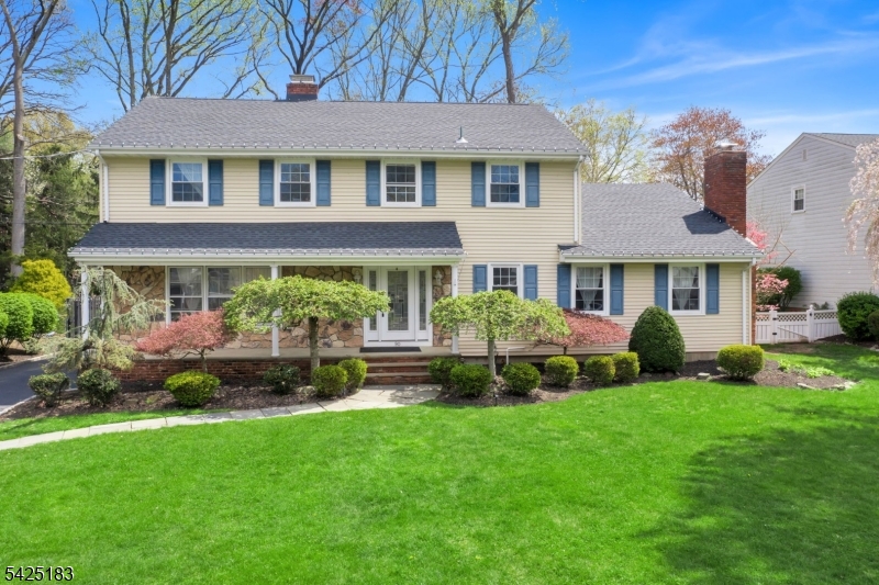 Welcome to this beautifully updated home in desirable Cranford Township, offering 4 bedrooms and 3.5 baths with a perfect blend of classic elegance and modern upgrades. Hardwood floors run throughout, complementing the formal living and dining rooms ideal for entertaining. Enjoy cozy evenings by the woodburning fireplaces in both the living and family rooms, while the family room also features recessed lighting and crown molding. The eat-in kitchen is a chef's dream with granite countertops, center island, butler's station, and premium GE Monogram and GE Profile stainless steel appliances, including a 48" refrigerator, cooktop, wall oven, warming drawers, and wine refrigerator.Upstairs, the spacious primary suite offers a private retreat with high ceilings, a skylit bathroom, a gas fireplace, and its own balcony. Three additional bedrooms, a full bath, and the convenience of second-floor laundry complete this level. The fully finished basement provides more living space, featuring a full bathroom perfect for guests, recreation home office.This home is packed with valuable upgrades, including a new roof, furnace, and tankless water heater all installed in 2024 with two-zone baseboard heating and central air for year-round comfort. Step outside to a fully fenced, parklike backyard with a paver patio and a fully functional outdoor kitchen with sink, ideal for entertaining. Located from Nomahegan Park, this property offers both tranquility and convenience and has low taxes.