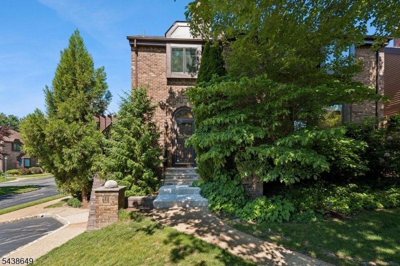 You are invited to a Beautiful "Free Standing Home" in Madison Green Village. Corner unit in peaceful enclave of 33 townhomes. Move-in ready 3 bedrooms, 2.1 baths, 2 decks, and 2 car garages and a wood-burning fireplace in family room. Interior was freshly painted. Many updates done to perfection. Hardwood floor on second floor,  2 baths, basement flooring, lighting, stove, dishwasher and Timbertek deck off the kitchen, perfect for outdoor living.  Laundry located on second floor with new washer and dryer. Work completed in 2022. Low HOA. Conveniently located approximately one mile to Madison Train Station.  A MUST SEE.