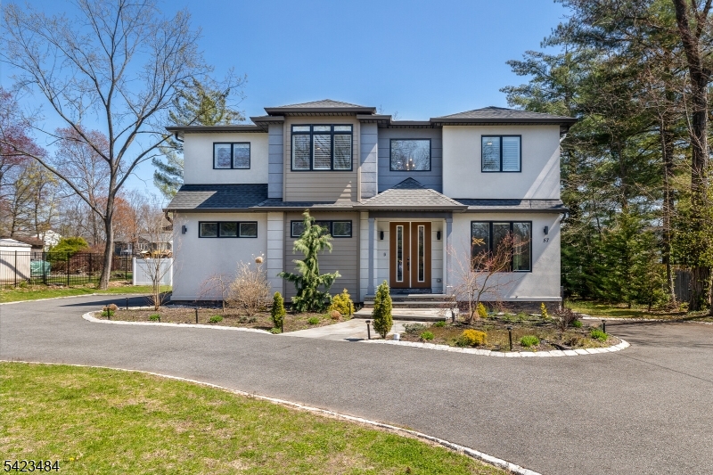 Welcome to this exceptional 5-bedroom, 4.1-bath luxury home in Livingston NJ, located in the desirable Cedar Hill neighborhood near Cedar Hill Golf Course. Set on .57 acres, this home offers the perfect blend of luxury, space, and modern efficiency. The primary suite features tray ceilings, a spacious walk-in closet, fireplace, and a spa-like bathroom. The gourmet kitchen with center island opens to a sun-filled family room with fireplace ideal for everyday living and entertaining. A fully finished basement with full bath and wet bar provides flexible space for recreation, guests, or a home office. Upgrades include Tesla solar panels for energy efficiency, reverse osmosis water filtration, custom Hunter Douglas shades, and plantation shutters throughout. Enjoy a fenced backyard with stone patio and irrigation system perfect for outdoor entertaining. Additional features include a 2-car garage and a prime location near top-rated Livingston schools, shopping, dining, and easy NYC commuting.
