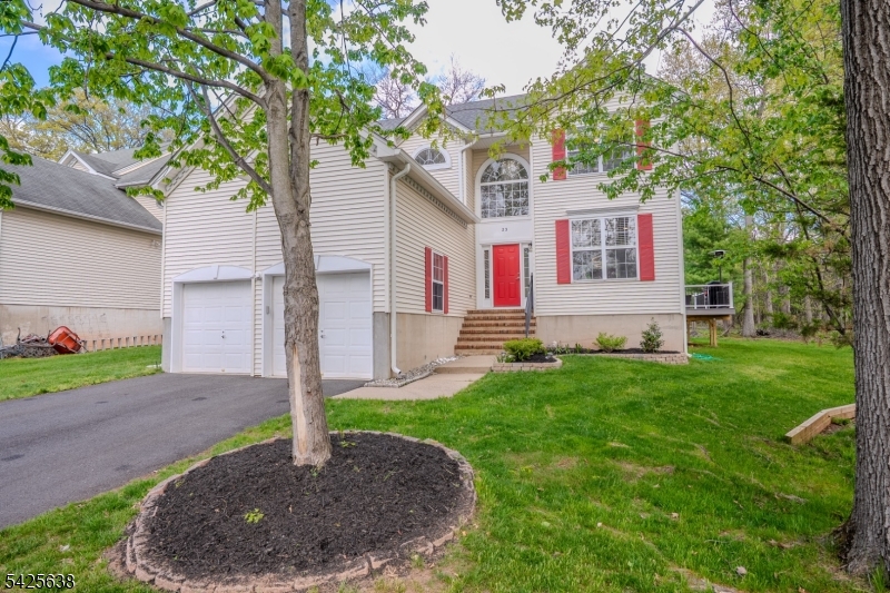 Welcome to this beautifully maintained and thoughtfully updated 4-bedroom, 2.5-bath home offering approximately 2,251 sq. ft. of comfortable living space in a desirable Bridgewater location. A grand two-story foyer with an elegant chandelier sets the tone for the warm and inviting interior. The first floor features hardwood flooring, recessed lighting, and custom blinds, creating a bright and modern feel. The updated kitchen (2018) offers quartz countertops, a designer backsplash, ceramic tile flooring, breakfast nook, pantry, built-in microwave, under-cabinet lighting, water filtration system, and a newer refrigerator (2021). The adjoining family room features a cozy gas fireplace. Upstairs includes newer carpeting and spacious bedrooms with ceiling fans. The guest bath is fully renovated with floor-to-ceiling porcelain tile, glass enclosure, and quartz countertop. The primary suite features two closets and a beautifully renovated bath with skylight, soaking tub, double sinks, quartz countertops, and a tiled shower with dual showerheads. Additional highlights include a first-floor laundry with built-ins, unfinished basement, and a 2-car garage with shelving and keypad access. Major updates include roof and HVAC (2021), furnace and hot water heater (5 years), and gutters (2 years). Enjoy outdoor living on the newer Trex deck with solar lighting, fire pit area, and Ring doorbell for added convenience.