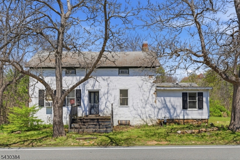 Step back in time with this charming 1700s-built 3-bedroom home filled with character and timeless appeal. From the moment you enter, the wide plank flooring throughout and historic charm create a warm and inviting atmosphere that is hard to find. The home features an eat-in kitchen, a convenient first-floor bedroom, and two additional bedrooms upstairs along with a cozy family room. What truly makes this property extraordinary is the breathtaking 1.87-acre setting. Venture beyond the home and discover your own private retreat complete with wooded trails and a peaceful stream running through the property. The backyard feels like your very own park, offering endless opportunities to fish, hike, picnic, or simply relax and enjoy nature. This is more than just a home it's a lifestyle filled with peace, history, and natural beauty. Come see the home, but be sure to explore the backyard  that is where the real magic begins. High Efficiency Gas boiler installed in 2021, New Well installed 2003