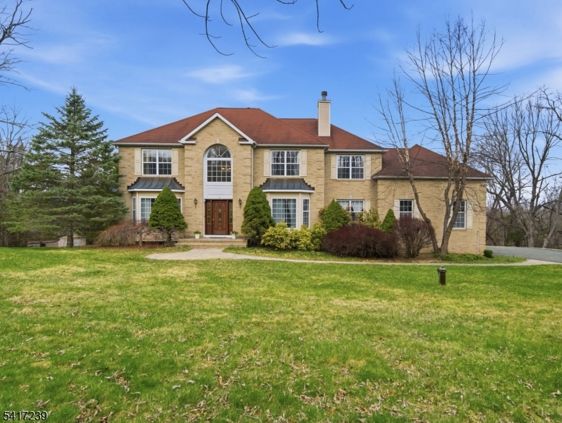 This one-of-a-kind colonial sits atop a scenic hill with stunning sunset and valley views. A grand two-story foyer welcomes you into a bright, spacious home featuring a gourmet kitchen with brand-new stainless steel appliances, custom island, and abundant cabinetry. Enjoy multiple living spaces, including a sunken living room with wood-burning fireplace, formal dining room, office/guest room with full bath, and convenient laundry room.Upstairs offers 3 bedrooms, a full bath, and a luxurious primary suite with sitting room, two walk-in closets, oversized en-suite bath, and additional storage space. The finished walkout basement is built for entertaining with a custom wet bar, dance floor, theater nook, seating area, and full bath. Situated on 4.5 acres with direct access to the Sussex Branch Trail, the property offers endless possibilities for recreation, gardening, outdoor entertaining, and more.