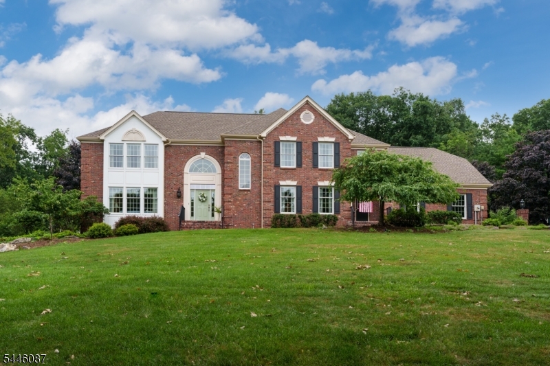 Tucked into Shy Creek Estates, one of Alexandria Township's most desirable neighborhoods, this inviting home offers the kind of setting that never goes out of style. Set well back from the road on a beautifully manicured lot, it provides a sense of privacy while remaining close to some of the area's favorite destinations, including Beneduce Vineyards and the Pittstown Inn. Designed for everyday living and special occasions alike, the home features a timeless floor plan with formal living and dining rooms, a dedicated home office, and a welcoming family room with a fireplace where everyone can gather at the end of the day. The spacious kitchen is both functional and comfortable, with a center island, stainless steel appliances, and a sunny dining nook that naturally becomes the heart of the home. The laundry room includes a convenient second entrance, and a first-floor powder room is thoughtfully placed for guests. Upstairs, four bright, generous bedrooms and two full bathrooms provide ample space to grow. The primary suite serves as a luxurious personal retreat, boasting an expansive walk-in closet and a spa-like bathroom where skylights flood the space with natural light.  Outside, the backyard features a relaxing patio for alfresco dining. A three-car garage provides generous space for vehicles, hobbies, and storage.  This is truly the ultimate forever home.