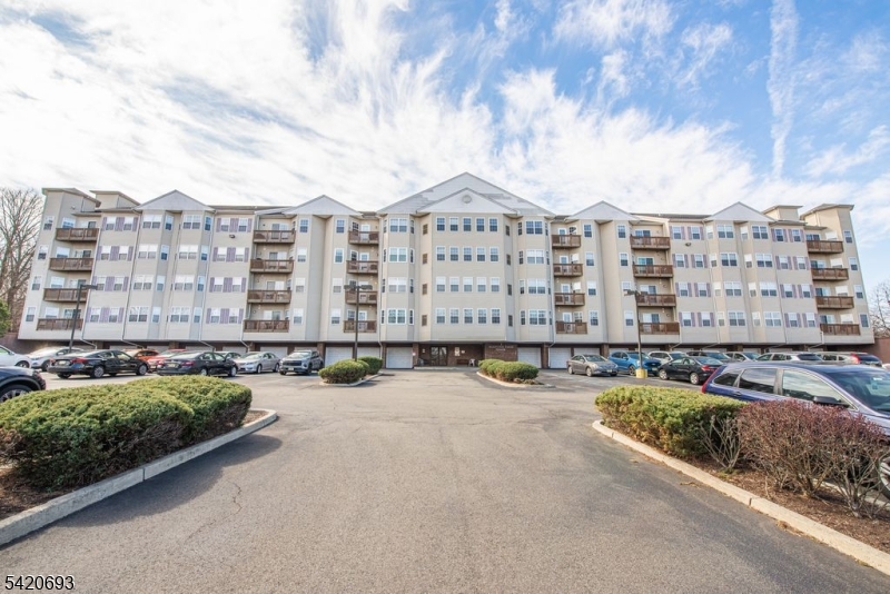 Nice 55 Plus building located in Woodland Park. It is located on top of Garret Mountain. Building has loads of parking but this unit offers a GARAGE. which is real premium in this building.  This 4TH FLOOR PENTHOUSE unit offers fantastic views of the mountains from it's balcony. The kitchen has an abundance of cabinets. Nice size laundry room  which as for additional storage.  Beautifully maintained by it's current owner with shining floors and granite counter top. Note: Separate tax bill for garage of $585.